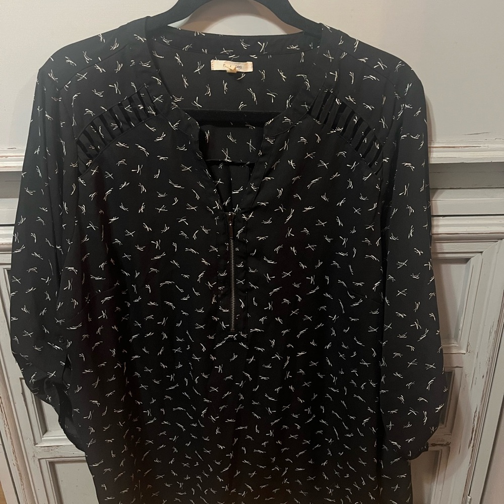 Maurices Black Blouse with White Design, zip up closure. Machine wash.